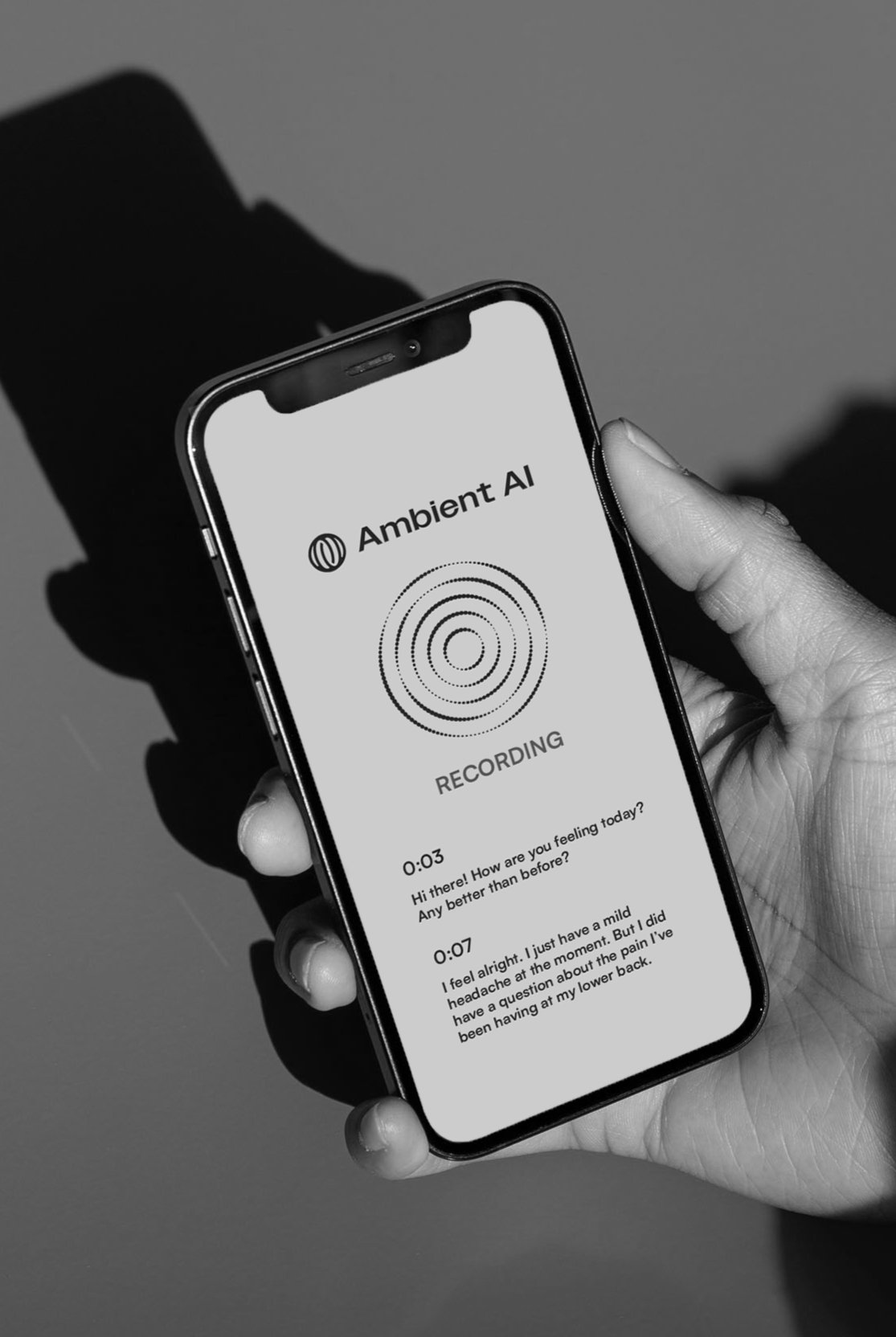 commure ambient ai phone hand